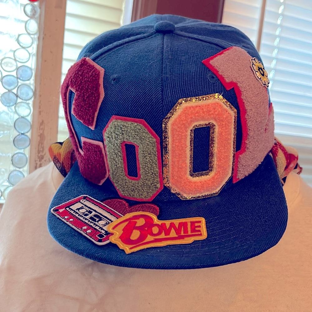 Artisan trucker hat. Says “Cool” never worn.